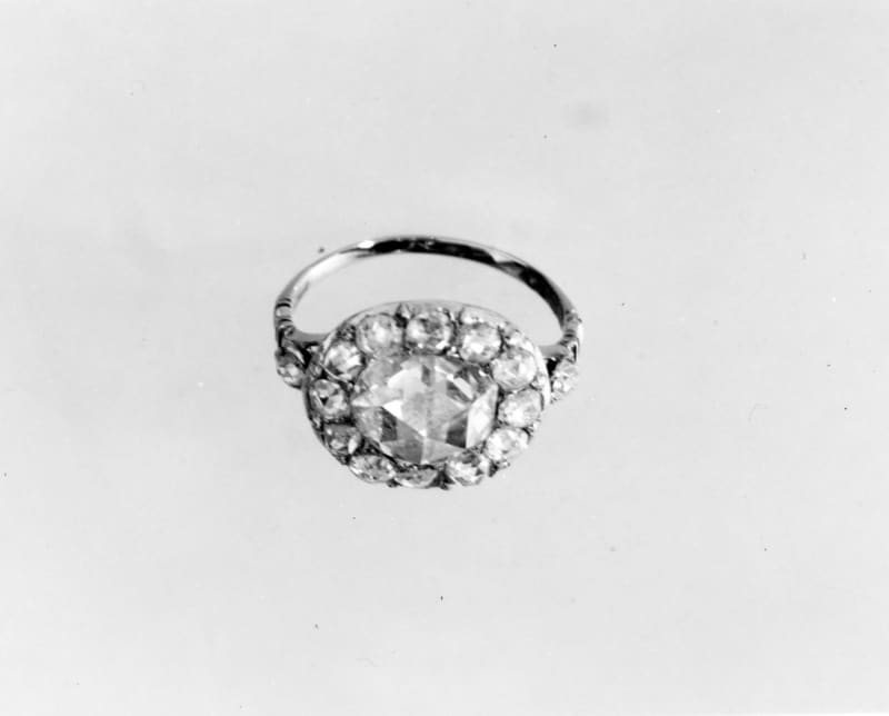 An eighteenth century gold ring set with a cluster of small diamonds