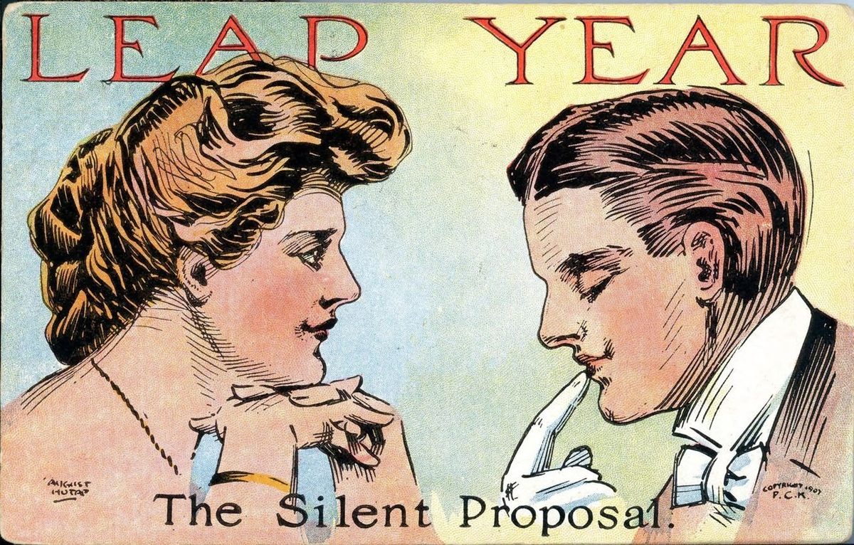 A colour postcard headed LEAP YEAR in red: a young woman looks hopefully at a young man, who stands with his eyes down and a gloved finger to his lips, above the words The Silent Proposal